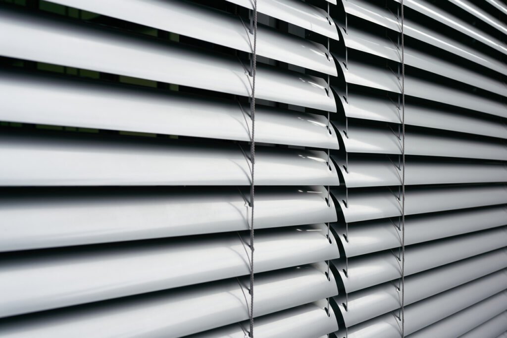 Blinds on the window of an office building in Berlin Aluminium Venetian Blinds installed in the Kitchen of HDB Singapore