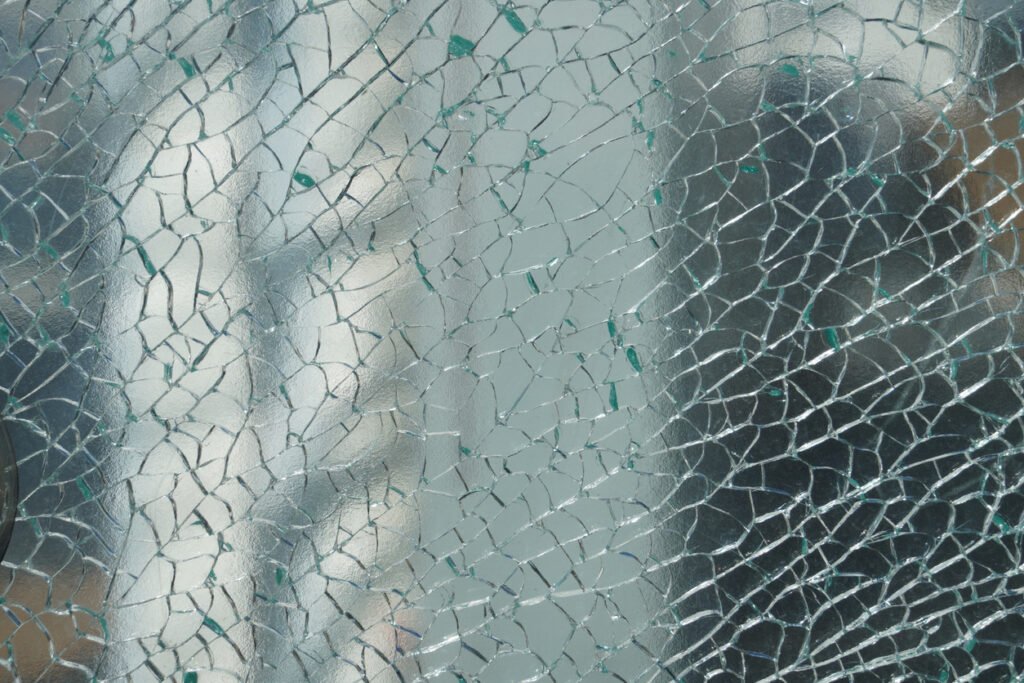 cracked window with safety film on